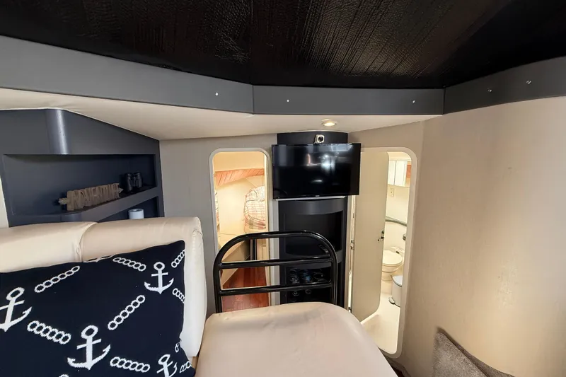 Slide: The Image of Interior of 1998 Mainship 47 Motor Yacht with cozy cabin and nautical decor. - 55