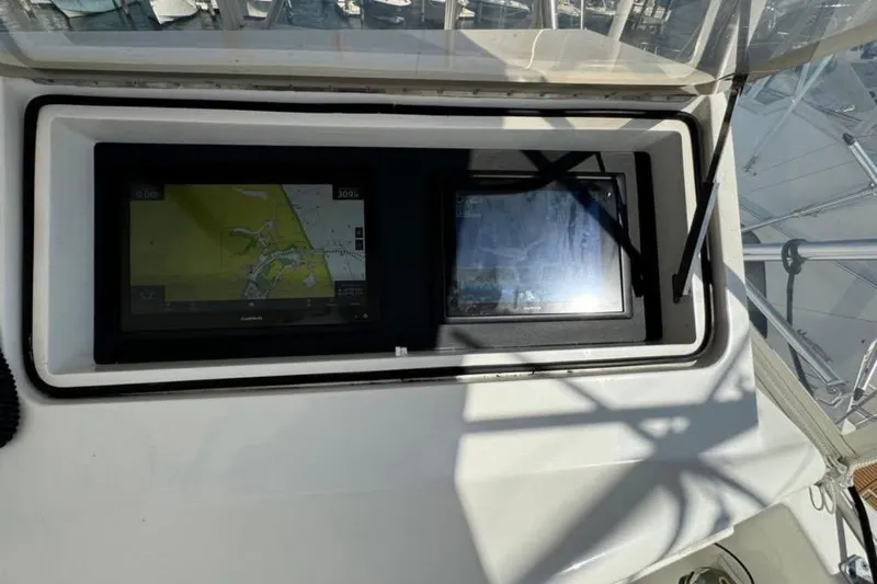 Slide: The Image of Navigation screens on a 2005 Ocean Yachts 46 Super Sport boat dashboard. - 10