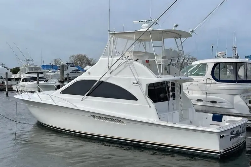 Slide: The Image of 2005 Ocean Yachts 46 Super Sport docked in marina, side view. - 3