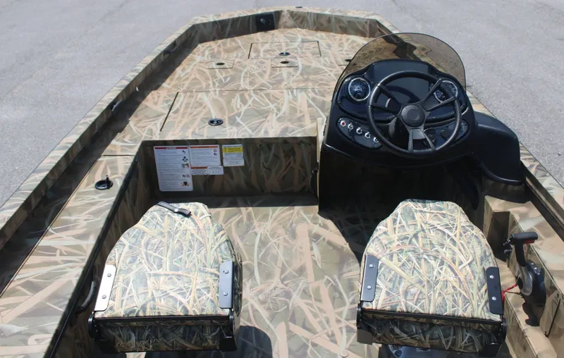 Slide: The Image of Lowe Outlet 20 boat 2025 with camouflage pattern and steering console. - 4