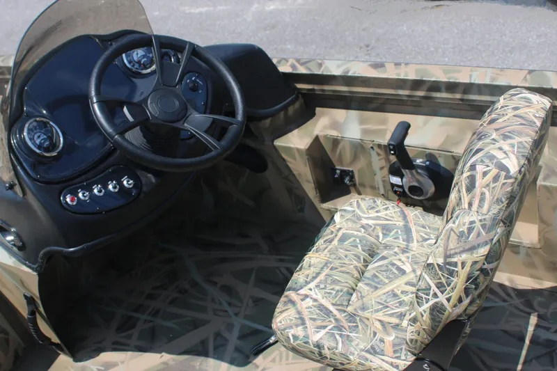 Slide: The Image of Interior of Lowe Outlet 20 boat, 2025 model, featuring camouflage design. - 5