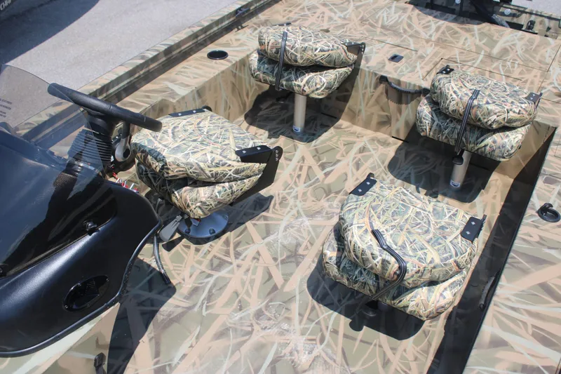 Slide: The Image of Lowe Outlet 20 boat 2025 with camouflage-patterned seats. - 8
