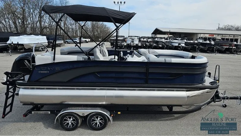 The Image of 2025 Lowe SS210 Walk-Thru pontoon boat on trailer. - 1