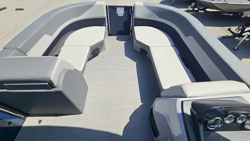 Slide: The Image of Interior of Lowe LS 190 boat, 2025 model, featuring gray seating. - 12