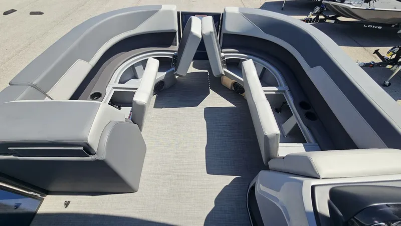 Slide: The Image of Interior of a 2025 Lowe LS 190 boat with gray seating. - 13
