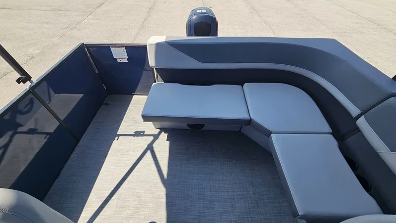 Slide: The Image of Interior of Lowe LS 190 pontoon boat, 2025 model, featuring gray upholstery. - 14