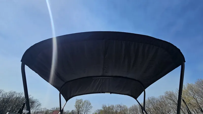 Slide: The Image of Lowe LS 190 boat canopy under blue sky, 2025 model. - 18
