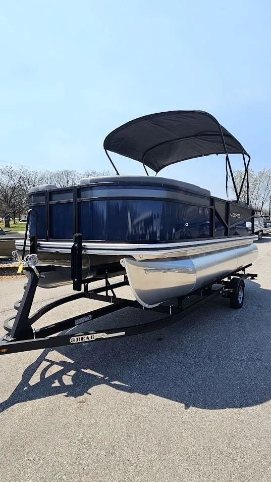 Slide: The Image of Lowe LS 190 pontoon boat 2025 on trailer, blue sky. - 5