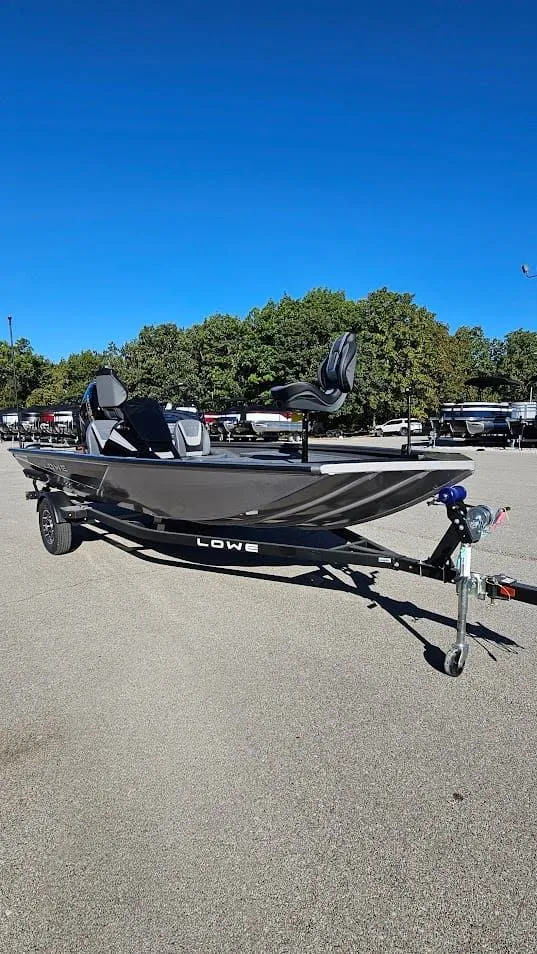 Slide: The Image of Lowe Stinger 175C 2026 on trailer, blue sky, parking lot. - 10