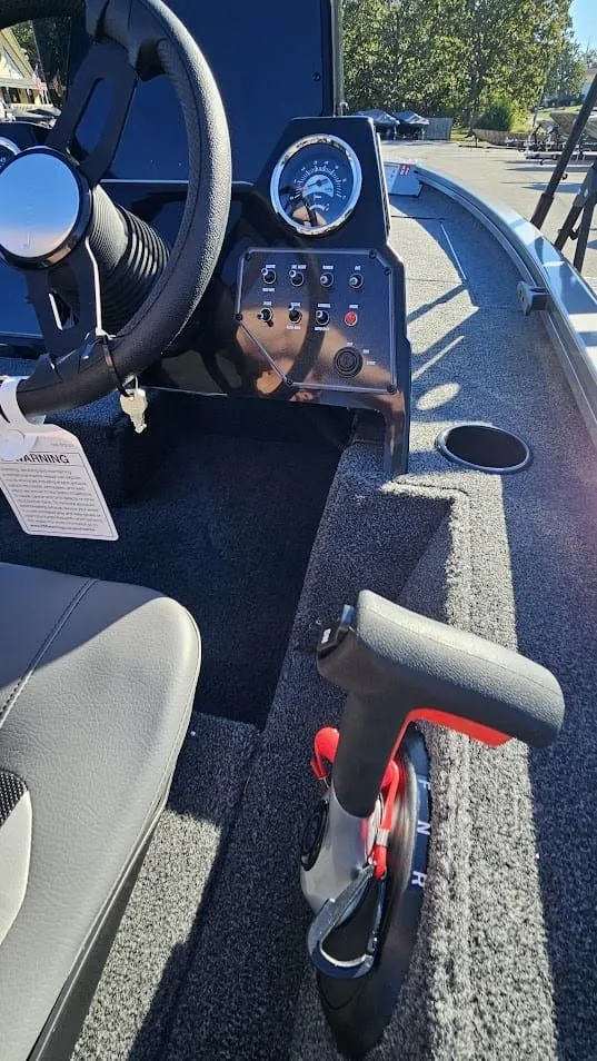 Slide: The Image of Interior view of 2026 Lowe Stinger 175C boat cockpit. - 14