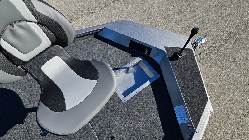 Slide: The Image of Interior of Lowe Stinger 175C boat, seat and control lever, year 2026. - 28