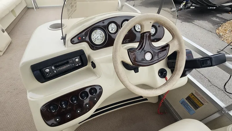 Slide: The Image of Dashboard of a 2000 Bennington 2050LX pontoon boat. - 13