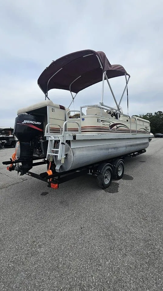 Slide: The Image of 2000 Bennington 2050LX pontoon boat on trailer. - 6