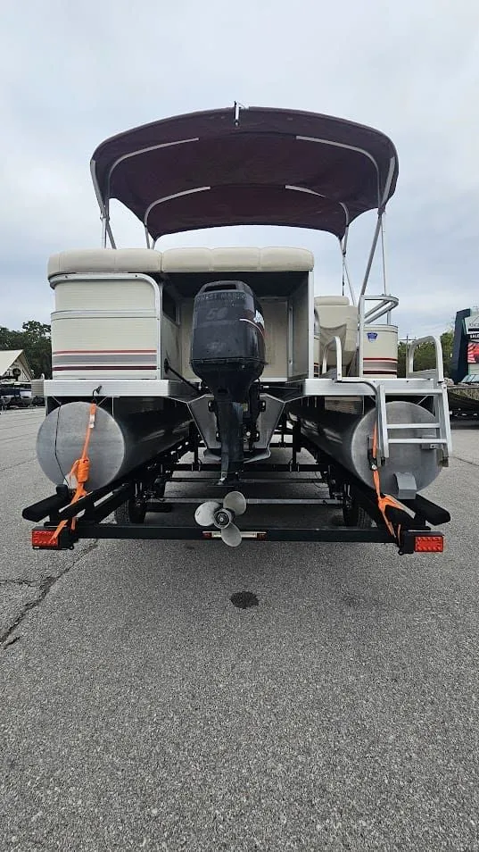 Slide: The Image of Rear view of a 2000 Bennington 2050LX pontoon boat on a trailer. - 7