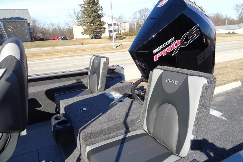 Slide: The Image of 2026 Lund 2075 Impact XS boat with Mercury Pro XS engine, featuring comfortable seating. - 11