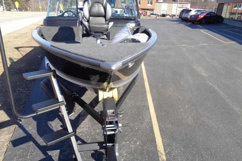 Slide: The Image of 2026 Lund 2075 Impact XS boat on trailer in parking lot. - 20