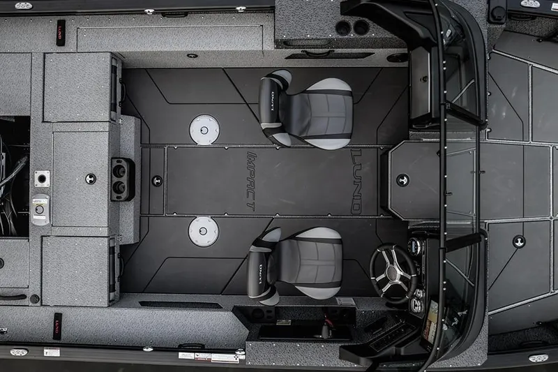 Slide: The Image of Manufacturer Provided Image: 2026 Lund 2075 Impact XS boat interior with two seats and steering console. - 25