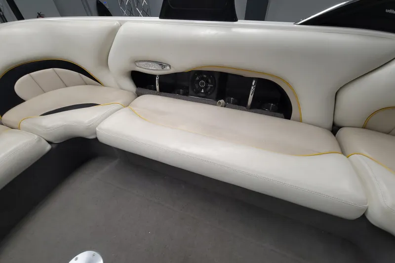 Slide: The Image of 2006 Malibu Wakesetter 23 LSV interior with white seating and cup holders. - 10