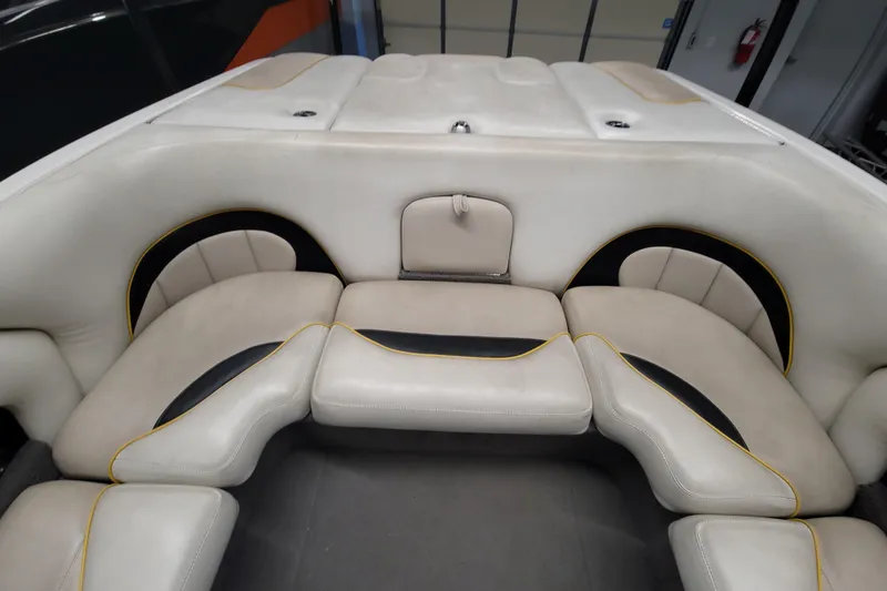 Slide: The Image of 2006 Malibu Wakesetter 23 LSV interior seating with beige and black upholstery. - 11