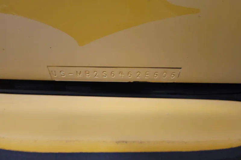 Slide: The Image of 2006 Malibu Wakesetter 23 LSV hull identification number on yellow surface. - 17