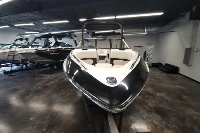 Slide: The Image of 2006 Malibu Wakesetter 23 LSV boat displayed indoors, showcasing sleek design and spacious interior. - 3