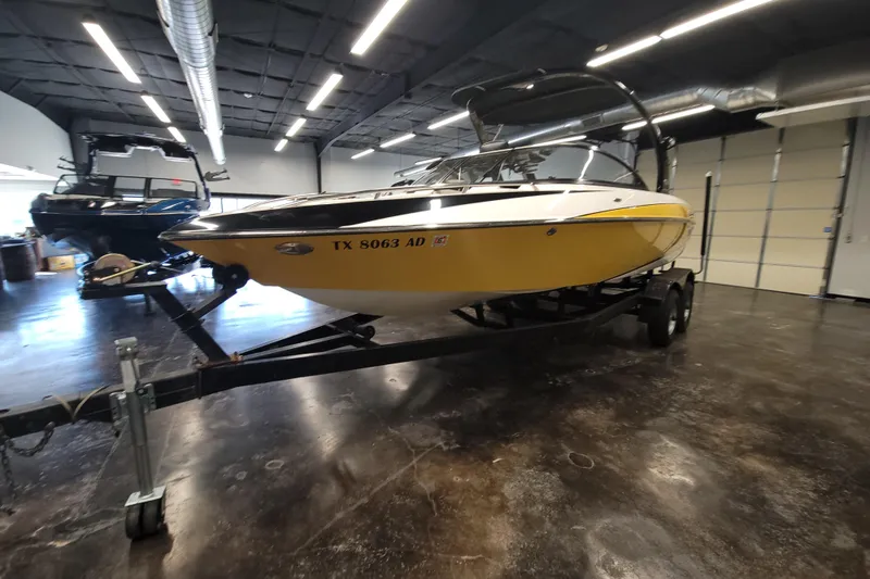 Slide: The Image of 2006 Malibu Wakesetter 23 LSV boat on trailer in indoor showroom. - 4
