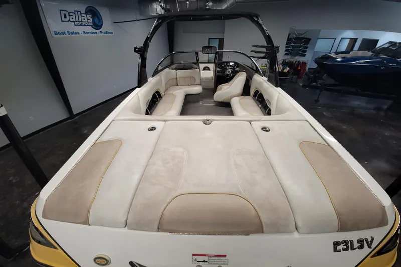 Slide: The Image of 2006 Malibu Wakesetter 23 LSV interior with beige seating at Dallas Boathouse showroom. - 8