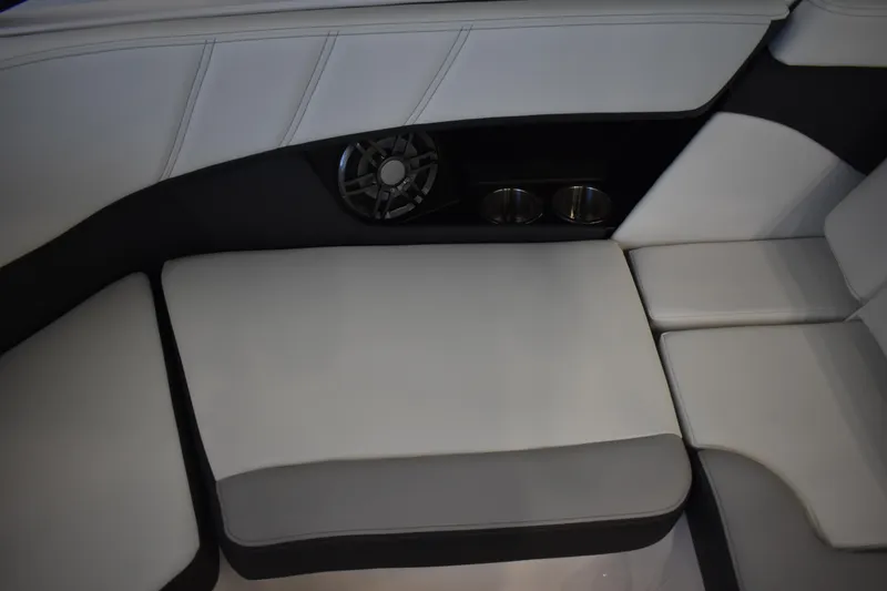 Slide: The Image of 2026 Regal 2000 ES boat interior with cushioned seating and built-in speaker. - 10