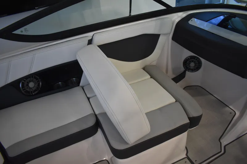 Slide: The Image of 2026 Regal 2000 ES boat interior with cushioned seating and built-in speakers. - 12