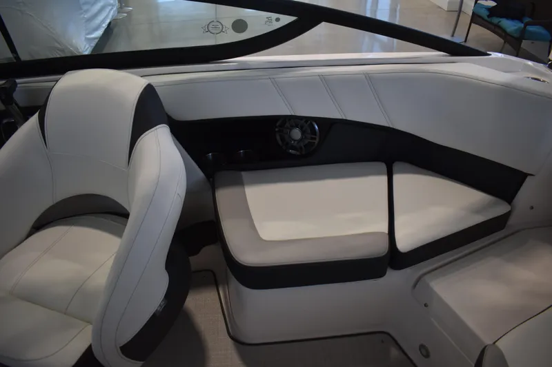 Slide: The Image of Interior of 2026 Regal 2000 ES boat with white seating and speaker. - 15