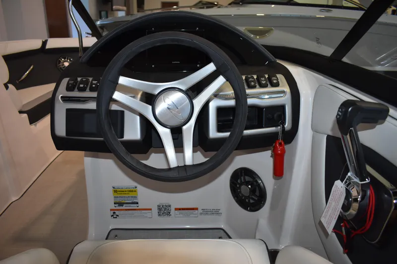 Slide: The Image of 2026 Regal 2000 ES boat dashboard with steering wheel and control panel. - 16