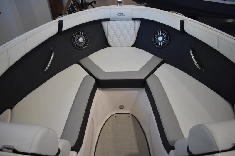 Slide: The Image of 2026 Regal 2000 ES boat interior with cushioned seating and built-in speakers. - 21