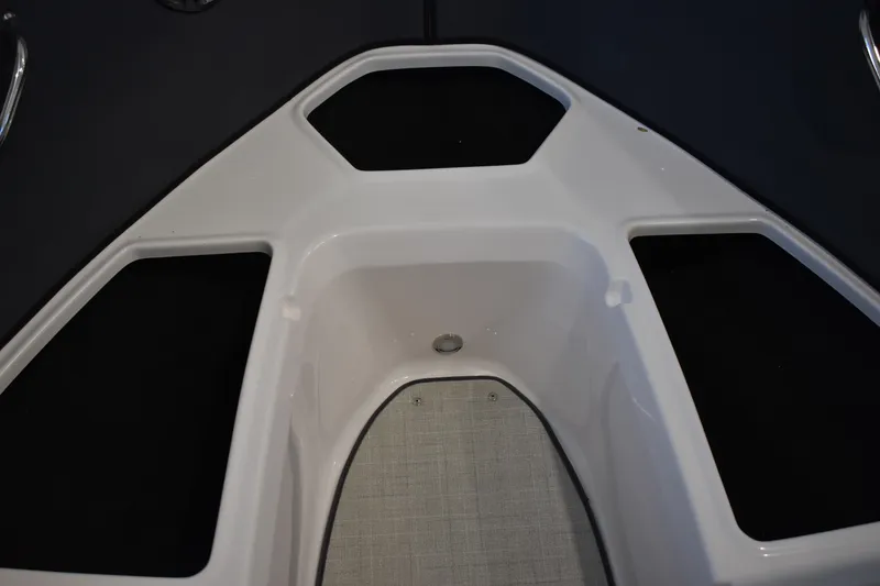Slide: The Image of Bow seating area of 2026 Regal 2000 ES boat with storage compartments. - 22