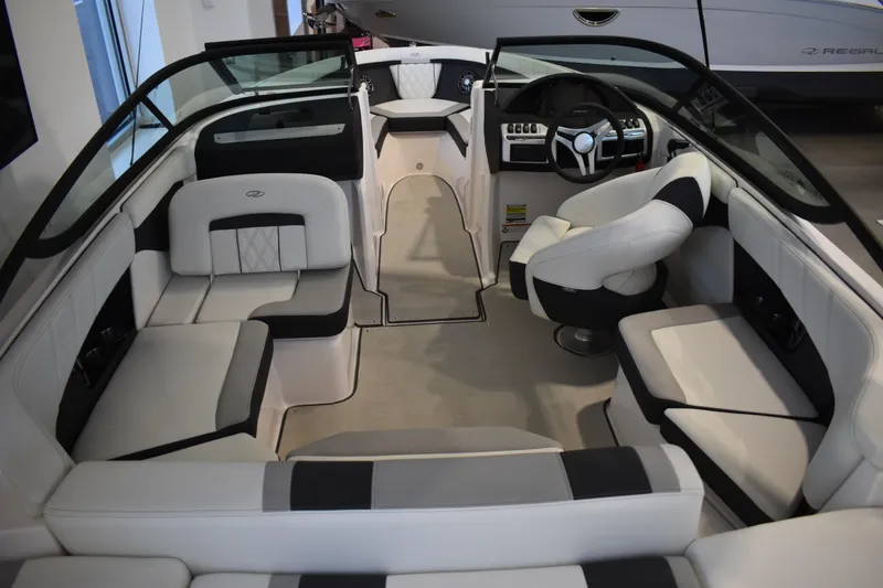 Slide: The Image of 2026 Regal 2000 ES boat interior with modern seating and steering wheel. - 4