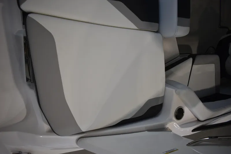 Slide: The Image of 2026 Regal 2000 ES boat interior with sleek, modern white and gray seating design. - 5