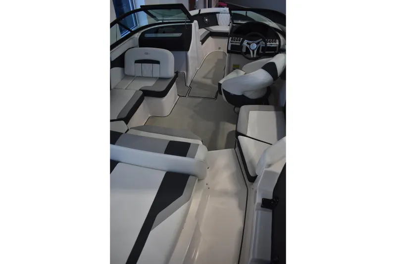 Slide: The Image of 2026 Regal 2000 ES boat interior with sleek seating and modern dashboard design. - 7