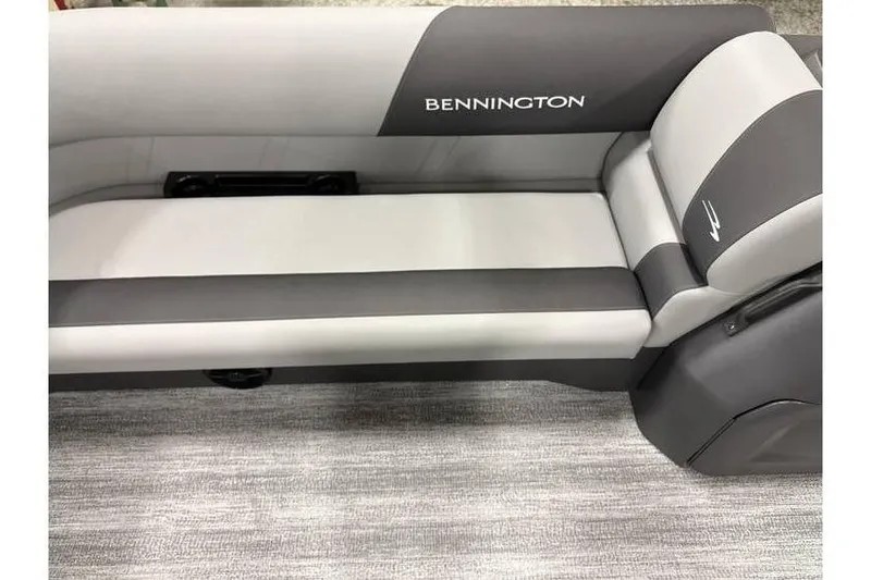 Slide: The Image of 2026 Bennington 21 SL boat seating with privacy curtain, featuring sleek gray upholstery. - 14
