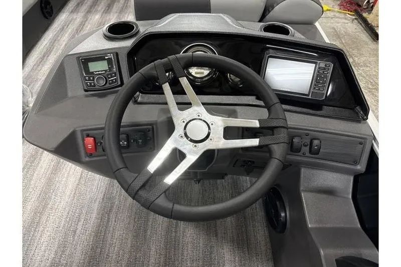 Slide: The Image of Steering console of 2026 Bennington 21 SL boat with modern controls and displays. - 17