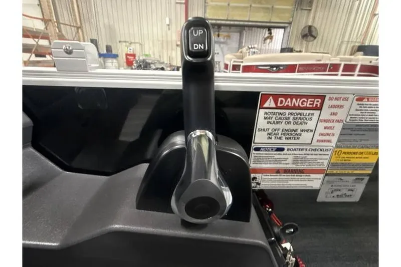 Slide: The Image of Throttle control lever on a 2026 Bennington 21 SL boat with safety warnings. - 18