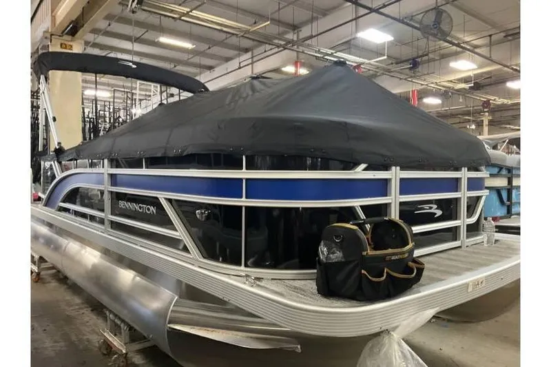 Slide: The Image of 2026 Bennington 21 SL pontoon boat with privacy curtain, covered and in stock. - 9