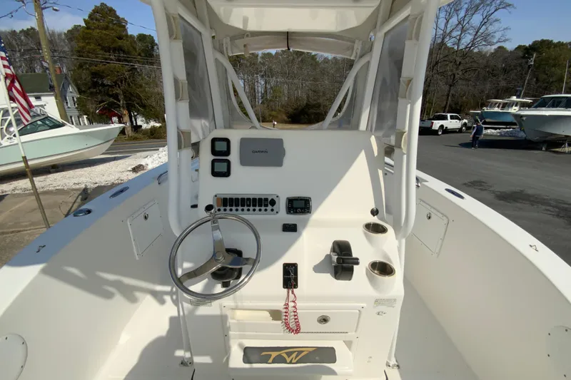 Slide: The Image of 2014 Tidewater 250 CC Adventure boat console with steering wheel and Garmin navigation system. - 10