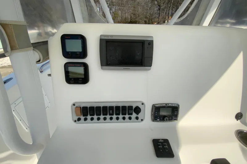 Slide: The Image of Control panel of 2014 Tidewater 250 CC Adventure boat with navigation and electronic displays. - 11