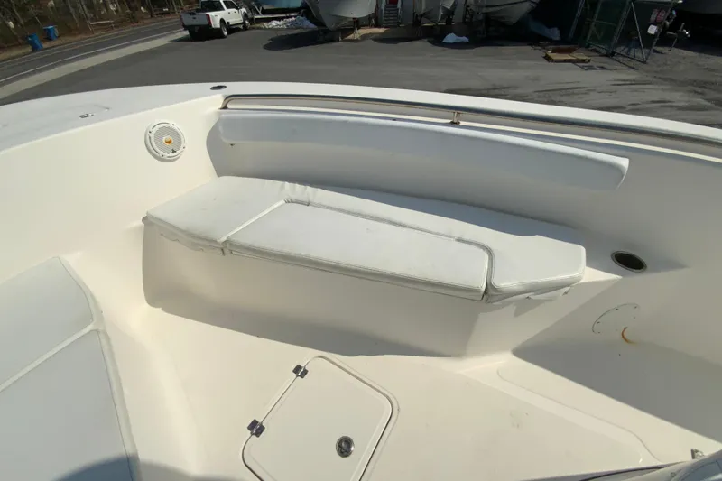 Slide: The Image of 2014 Tidewater 250 CC Adventure boat interior with white cushioned seating. - 18