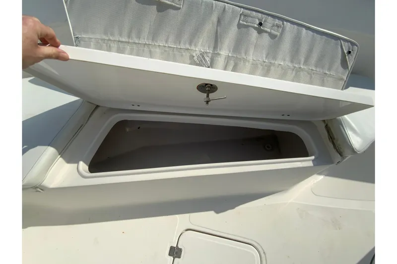 Slide: The Image of Open storage compartment on 2014 Tidewater 250 CC Adventure boat. - 19