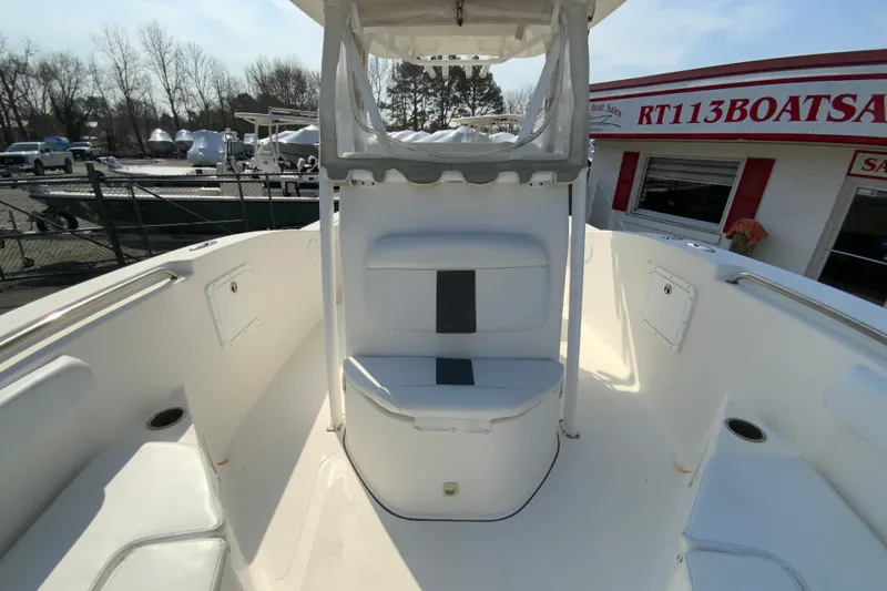 Slide: The Image of 2014 Tidewater 250 CC Adventure boat interior with seating and storage compartments. - 23
