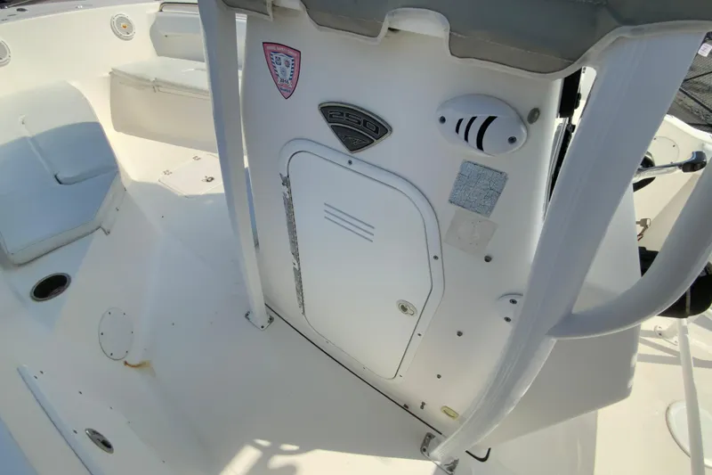 Slide: The Image of 2014 Tidewater 250 CC Adventure boat interior, featuring seating and storage compartments. - 24