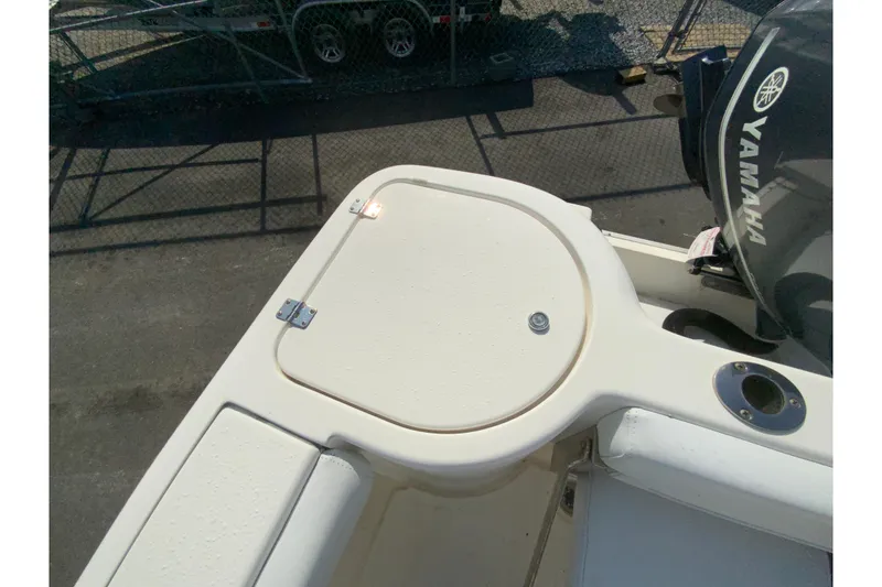Slide: The Image of 2014 Tidewater 250 CC Adventure boat with Yamaha engine, top view of deck and storage. - 26