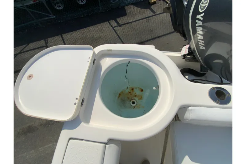 Slide: The Image of Open livewell on 2014 Tidewater 250 CC Adventure boat with Yamaha engine. - 27