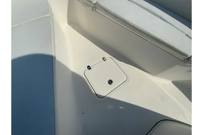 Slide: The Image of 2014 Tidewater 250 CC Adventure boat interior with storage compartment. - 28