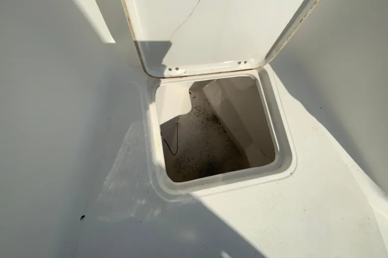 Slide: The Image of Open storage compartment on 2014 Tidewater 250 CC Adventure boat. - 30